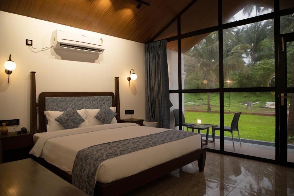 A bed or beds in a room at White Sand Beach Resort