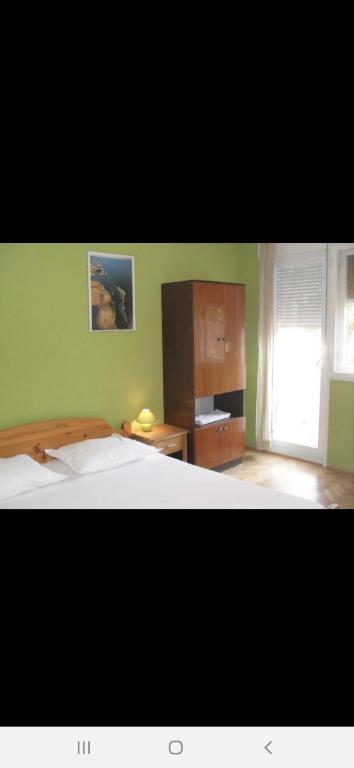 Postel nebo postele na pokoji v ubytování Basil Apartments and Rooms