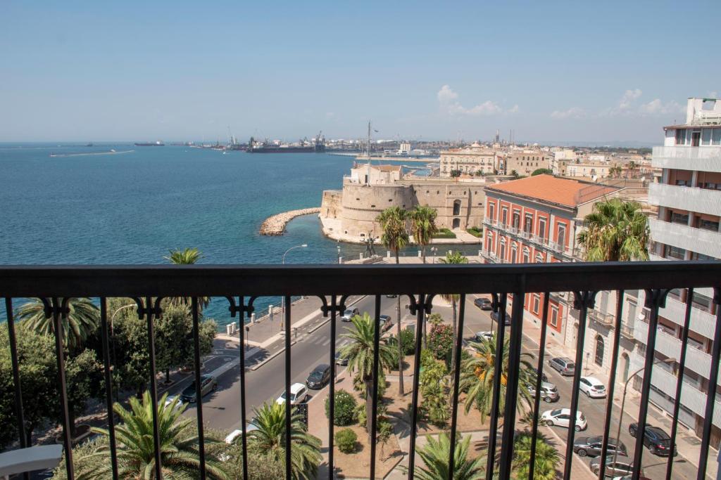 a view of the ocean from a balcony at Aragona Luxury Apartment - Fronte Mare in Taranto