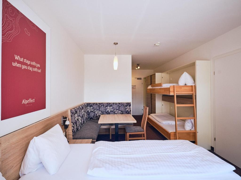 Postel nebo postele na pokoji v ubytování Hotel Planai by Alpeffect Hotels