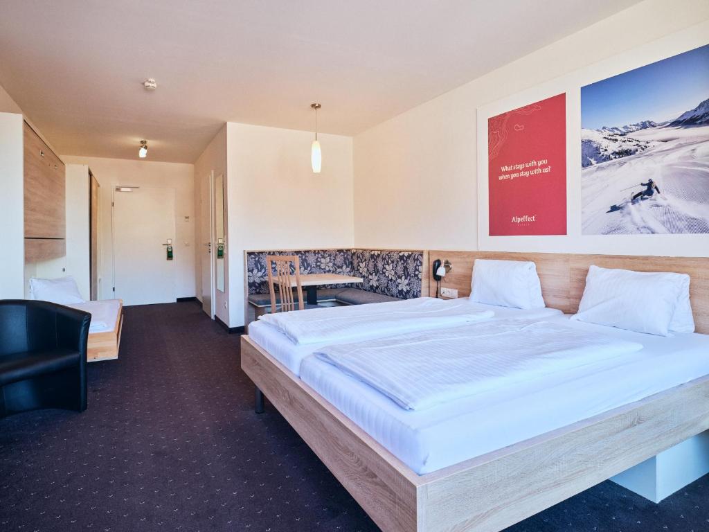 Postel nebo postele na pokoji v ubytování Hotel Planai by Alpeffect Hotels