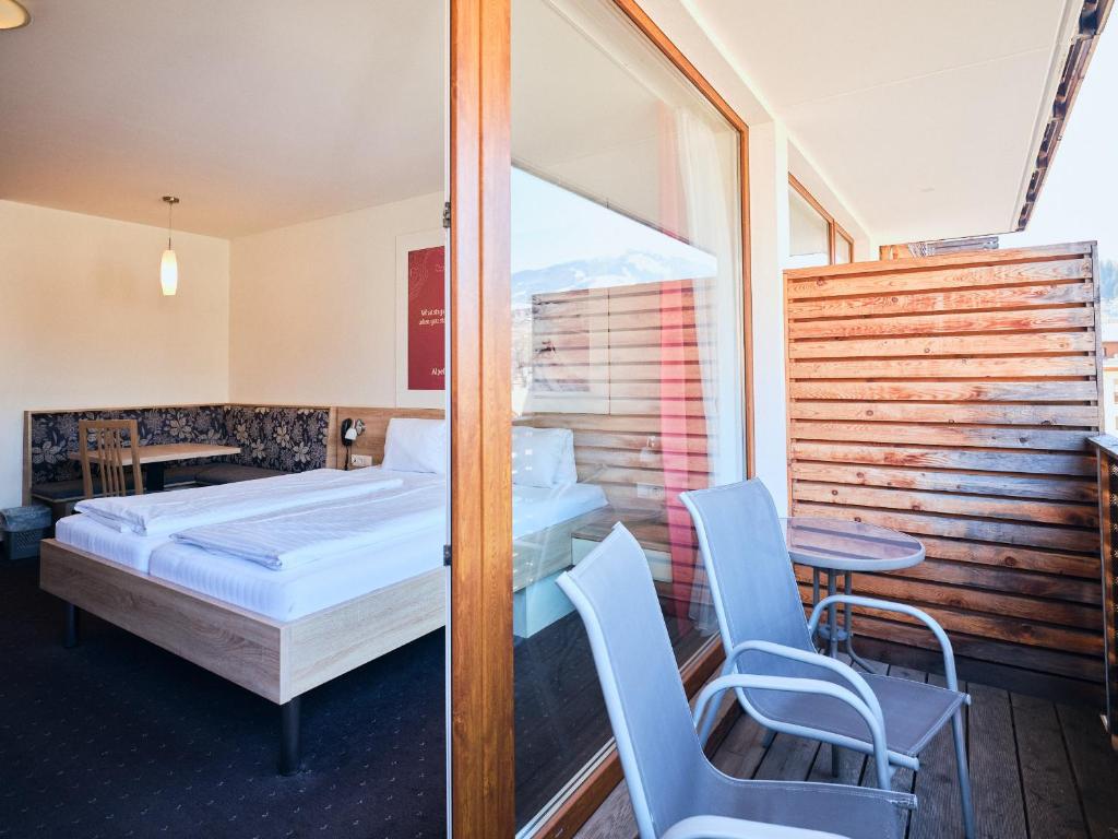 Postel nebo postele na pokoji v ubytování Hotel Planai by Alpeffect Hotels