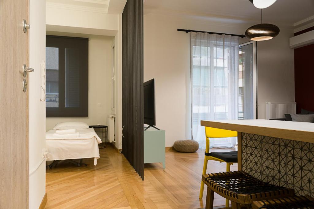 a room with a kitchen and a living room at Athens Special in Athens