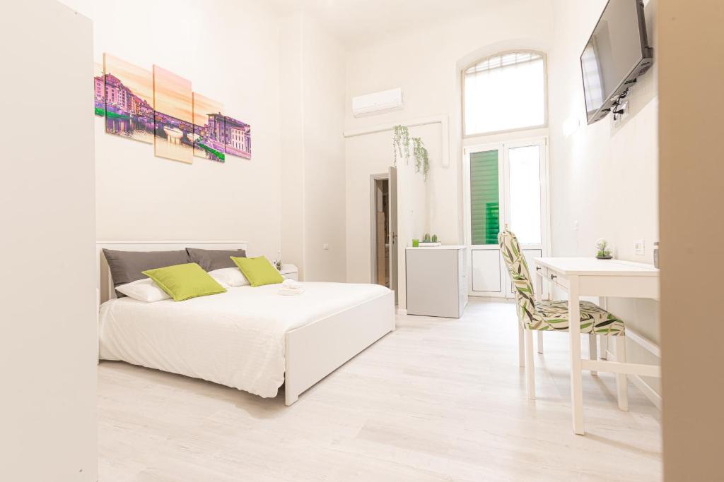 Ένα ή περισσότερα κρεβάτια σε δωμάτιο στο Signoria Guest House Florence