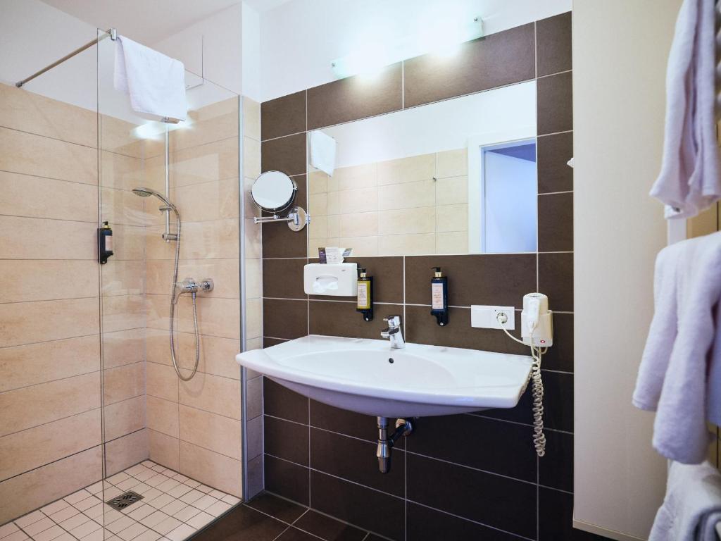 Koupelna v ubytování Hotel Planai by Alpeffect Hotels