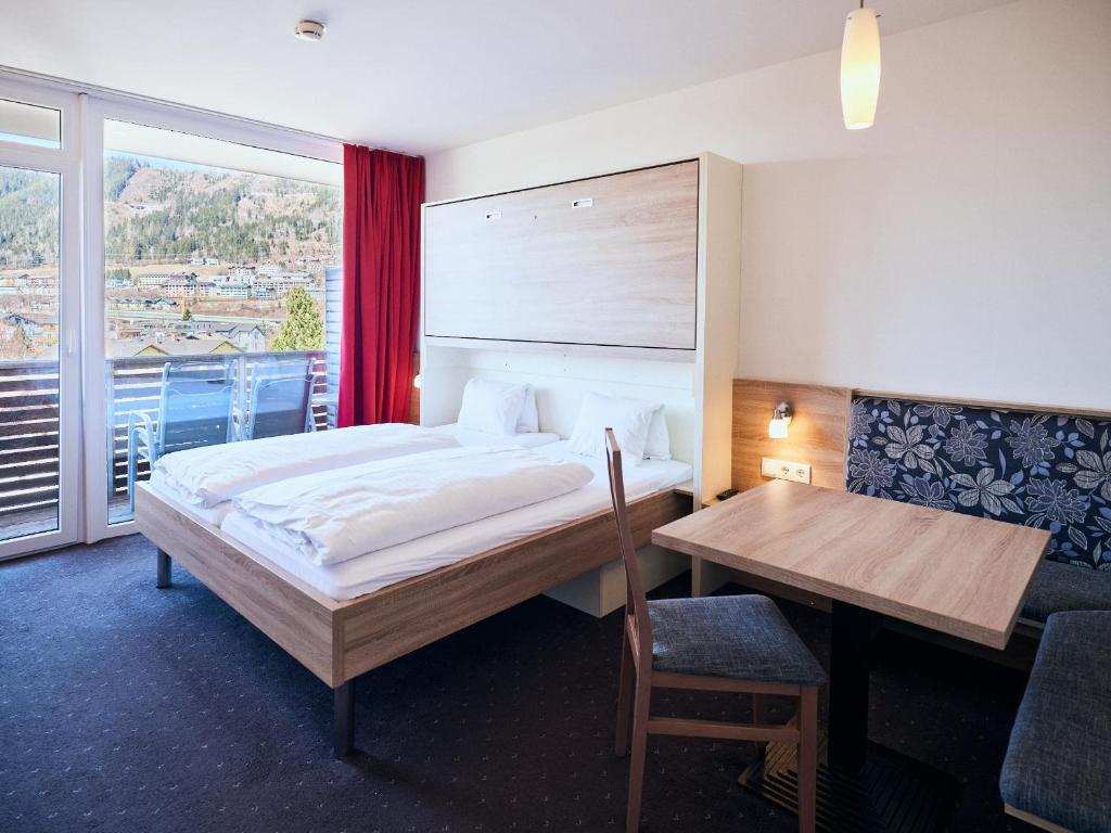 Postel nebo postele na pokoji v ubytování Hotel Planai by Alpeffect Hotels