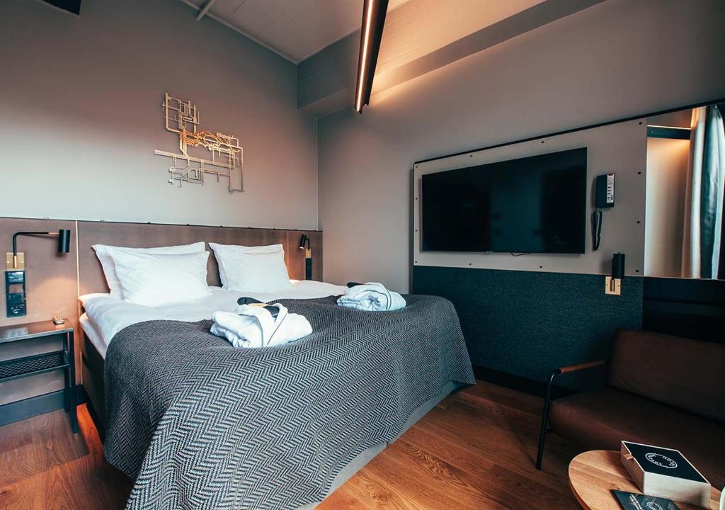 Postel nebo postele na pokoji v ubytování Clarion Hotel Mestari