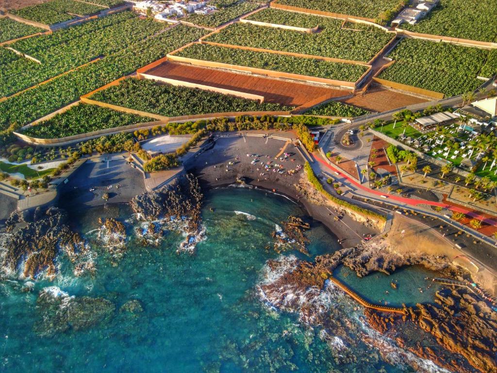 an aerial view of a beach next to the ocean at La Cala de Alcalá Luxury in Alcalá