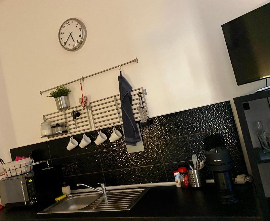 Kuchyň nebo kuchyňský kout v ubytování Benvenuto Apartman