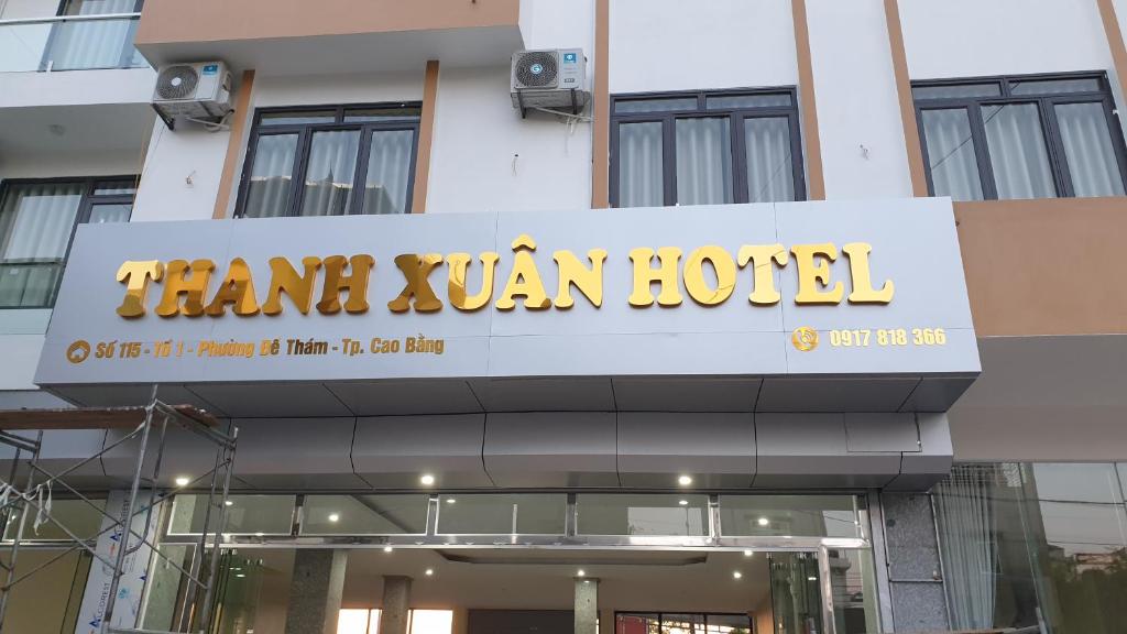 a sign for a hotel in front of a building at THANH XUÂN HOTEL in Cao Bằng