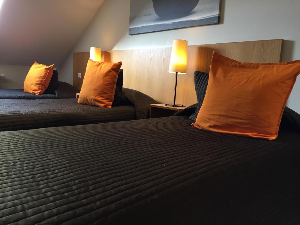 Postel nebo postele na pokoji v ubytování Hotel Pax