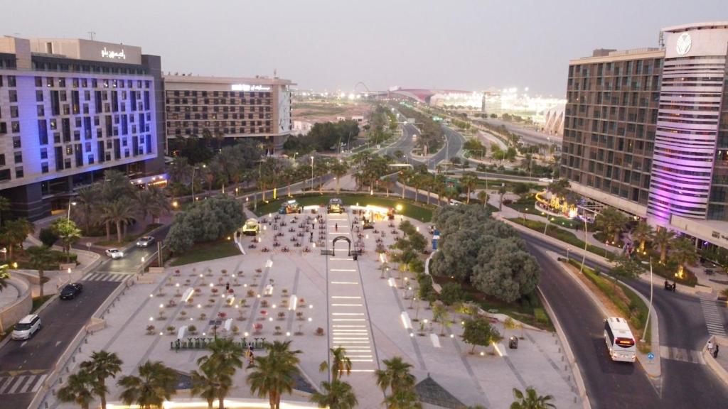 an aerial view of a plaza in a city with buildings at Crowne Plaza Yas Island by IHG in Abu Dhabi