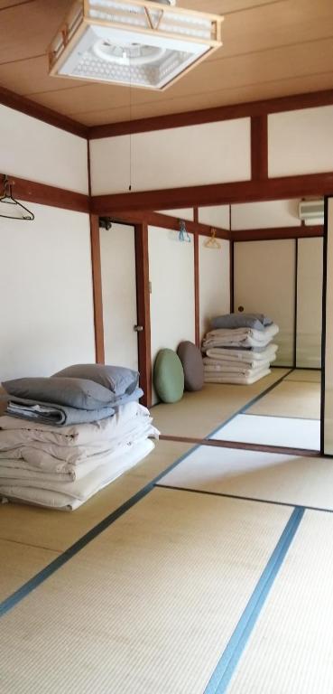 Postel nebo postele na pokoji v ubytování そらやまゲストハウス Sorayama guesthouse