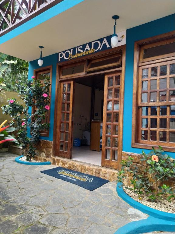 a building with a sign that reads pool malawi at Pousada Exuberante in Abraão