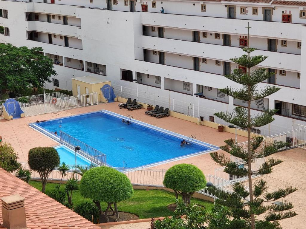 a large swimming pool in front of a building at Oasis Dakota Duplex in Adeje