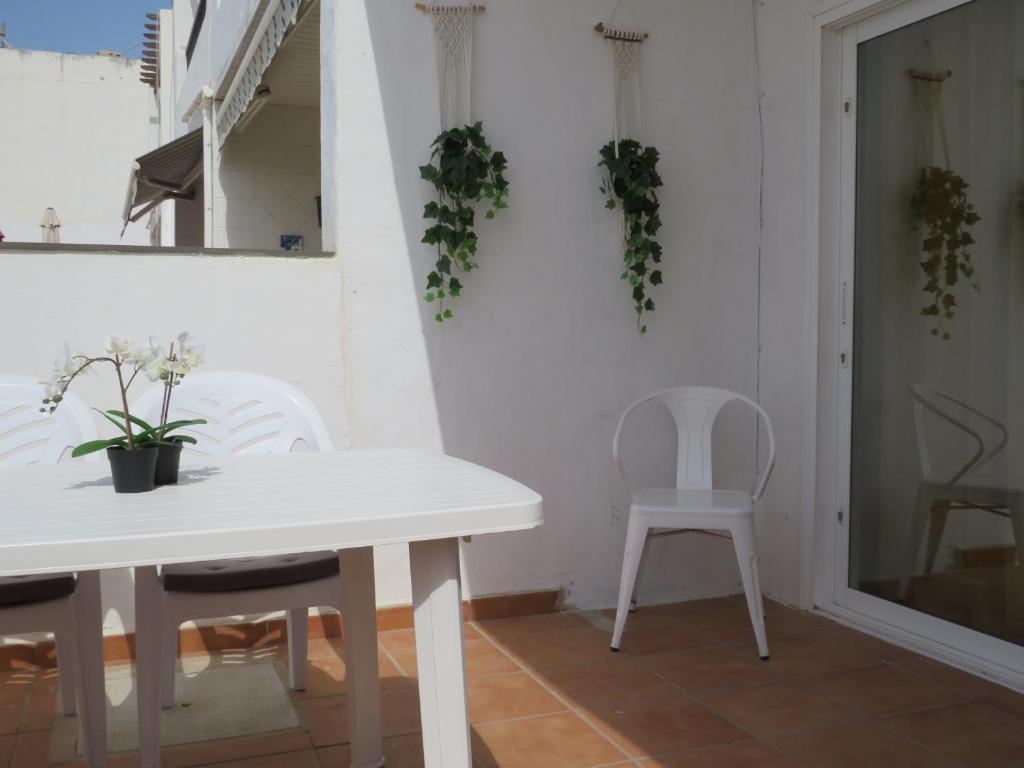 A balcony or terrace at Biósfera Modern Bright Old Town Two Bedroom Apartment PDC
