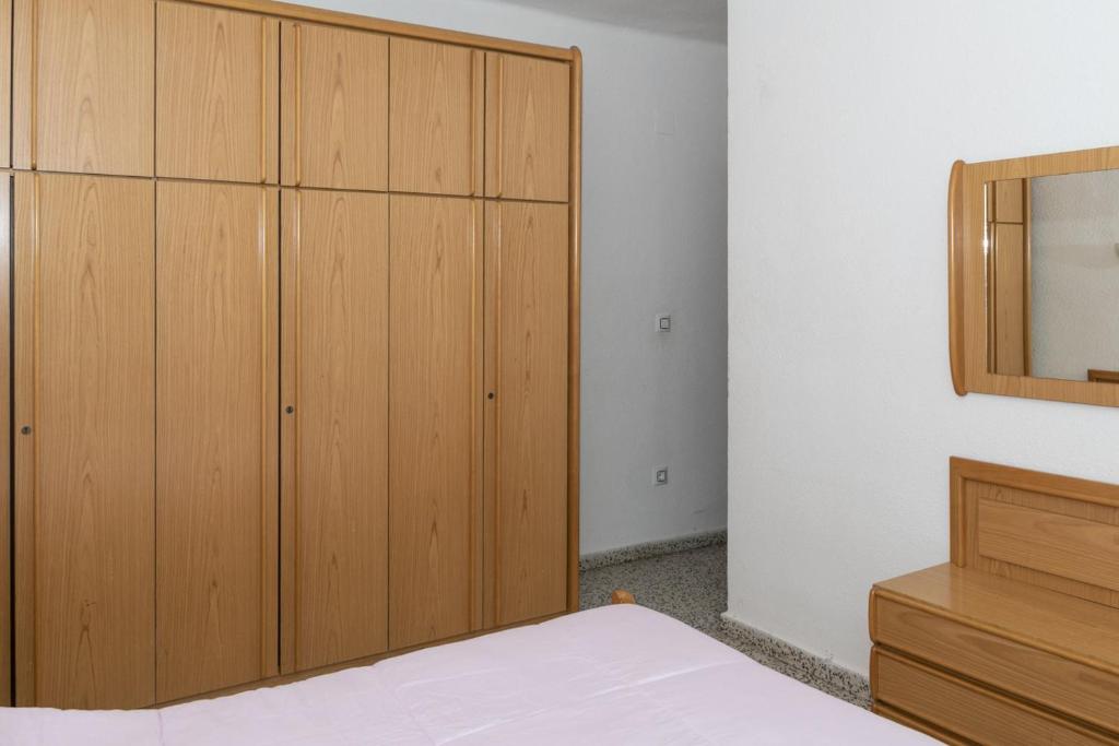 A bed or beds in a room at Miralmar, 10º-69