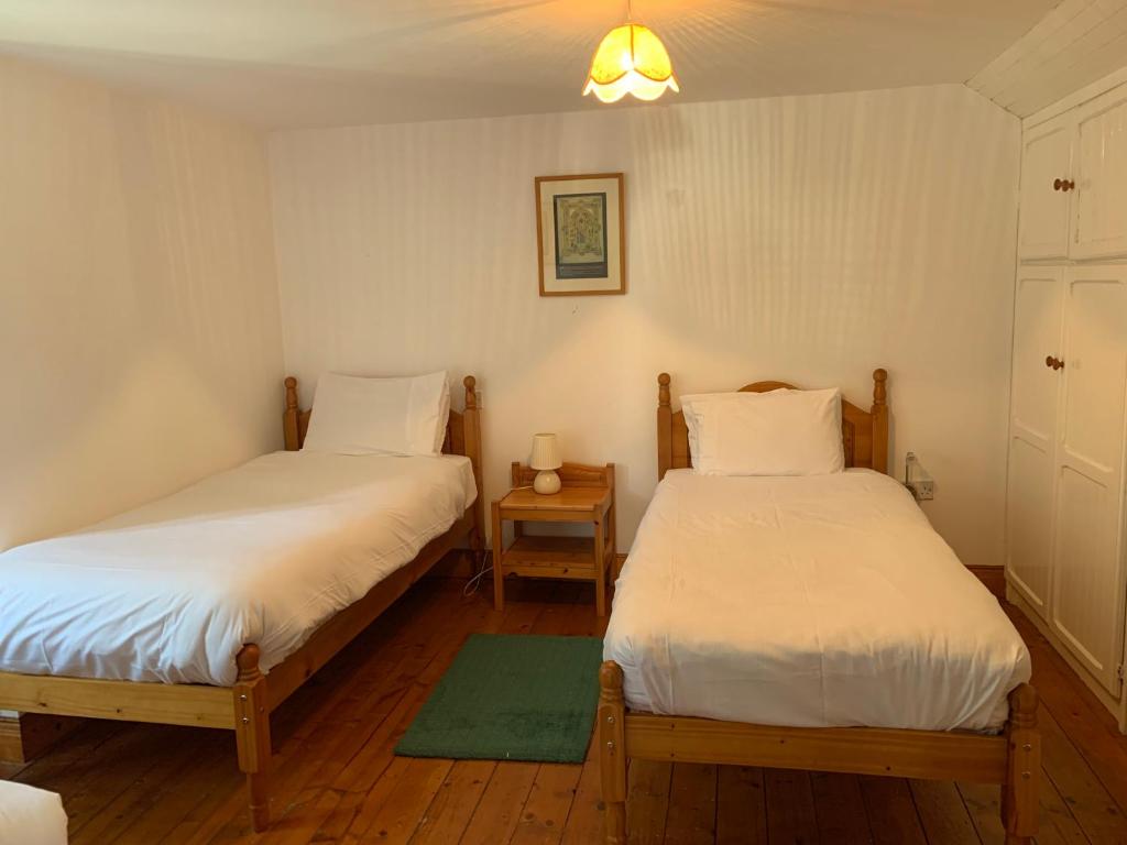 Postel nebo postele na pokoji v ubytování Killeena House