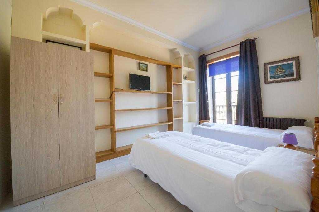 Postel nebo postele na pokoji v ubytování Albergue Villa San Clemente