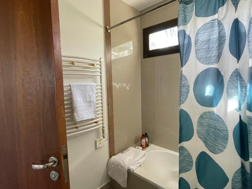a bathroom with a toilet and a sink and a shower at La Nube - San Lorenzo in San Lorenzo