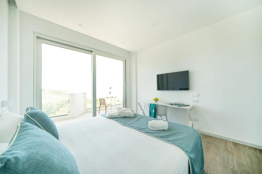 Postel nebo postele na pokoji v ubytování Rodi Resort