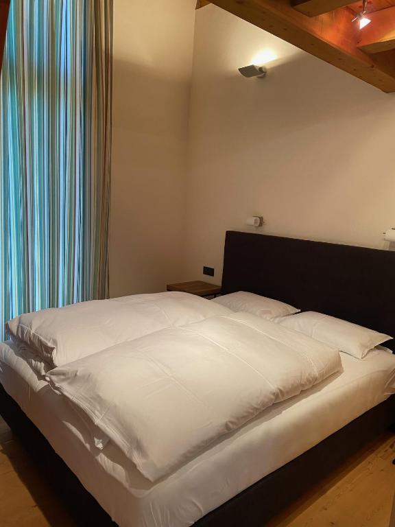 Postel nebo postele na pokoji v ubytování ClubHotel Hinterthal Am FlorySee 12