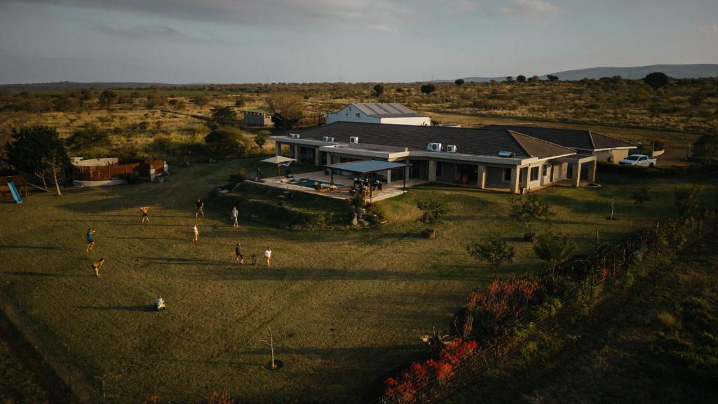 an aerial view of a house in a field at Tandweni Villa in Pongola Game Reserve