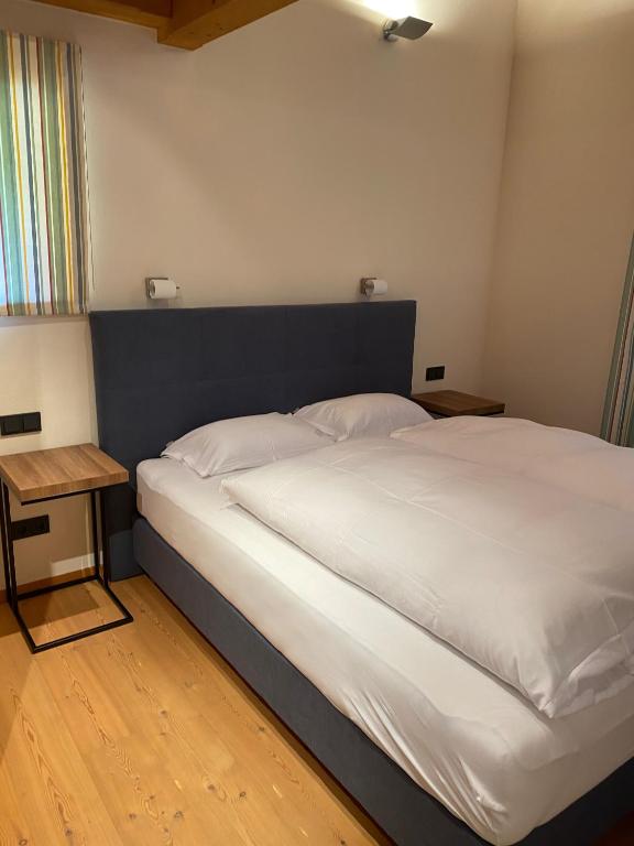 Postel nebo postele na pokoji v ubytování ClubHotel Hinterthal Am FlorySee 12