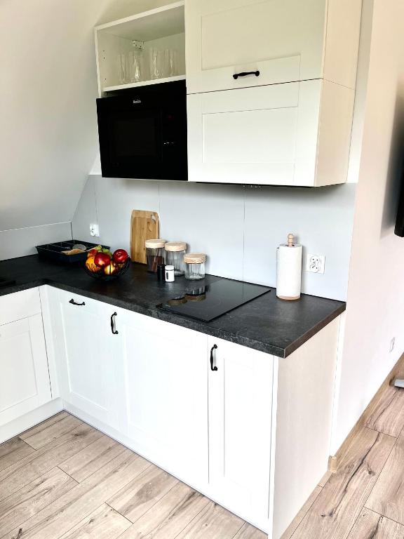 Kuchyňa alebo kuchynka v ubytovaní Apartamenty Widok Tatr