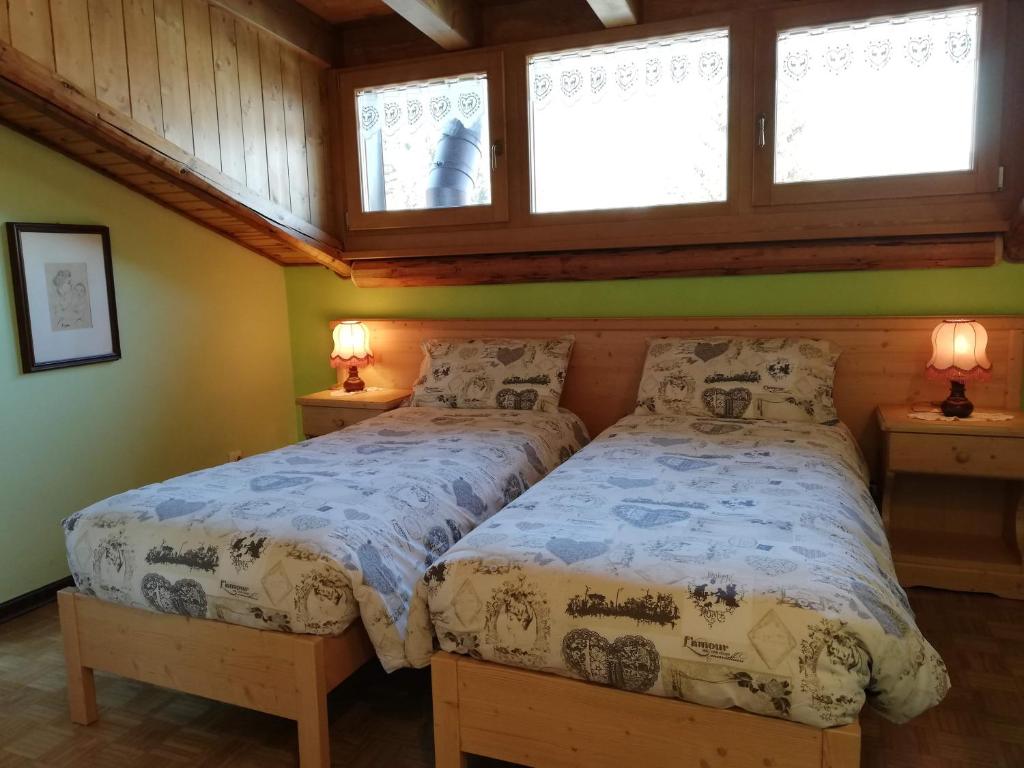 Postel nebo postele na pokoji v ubytování B&B La Genzianella