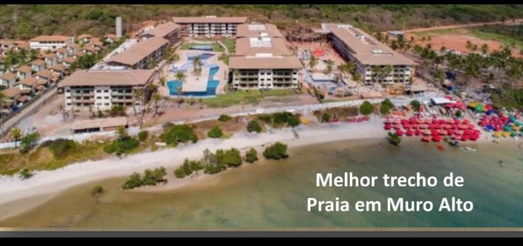an aerial view of a resort on a beach at La Fleur Polinésia Muro Alto in Porto De Galinhas