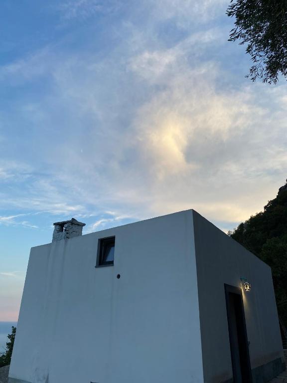a white building with a window on the side of it at Le Finestre di Amalfi in Amalfi