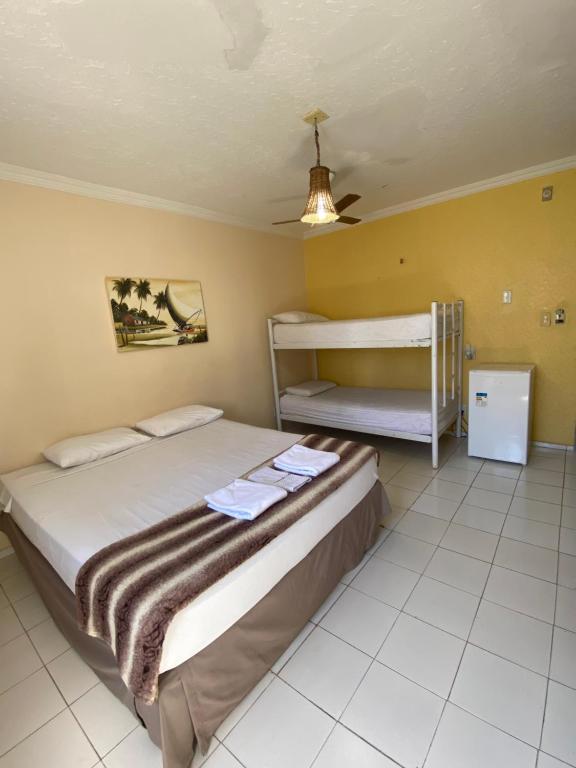 Postel nebo postele na pokoji v ubytování Maré Praia Hotel