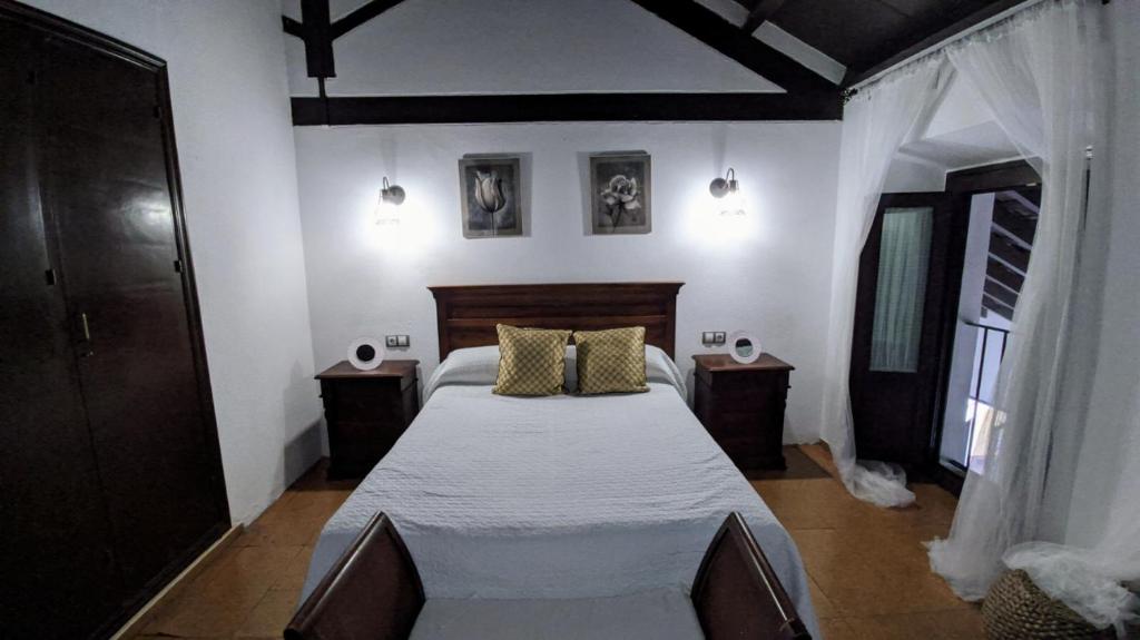 Łóżko lub łóżka w pokoju w obiekcie Apartamento Cabildo