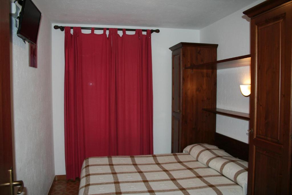 Postel nebo postele na pokoji v ubytování Hotel Beau Sejour