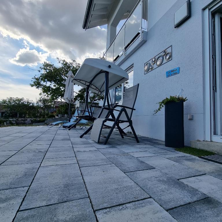 a group of chairs sitting outside of a building at Holiday Apartment Moises y Ruth in Murg