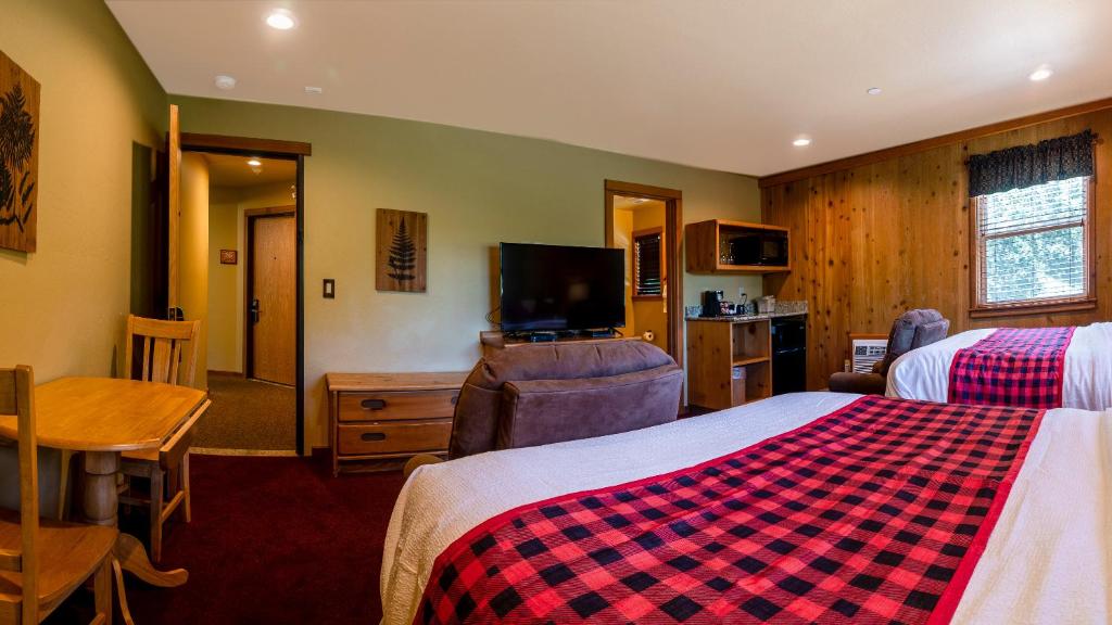 Postel nebo postele na pokoji v ubytování Callahan's Mountain Lodge