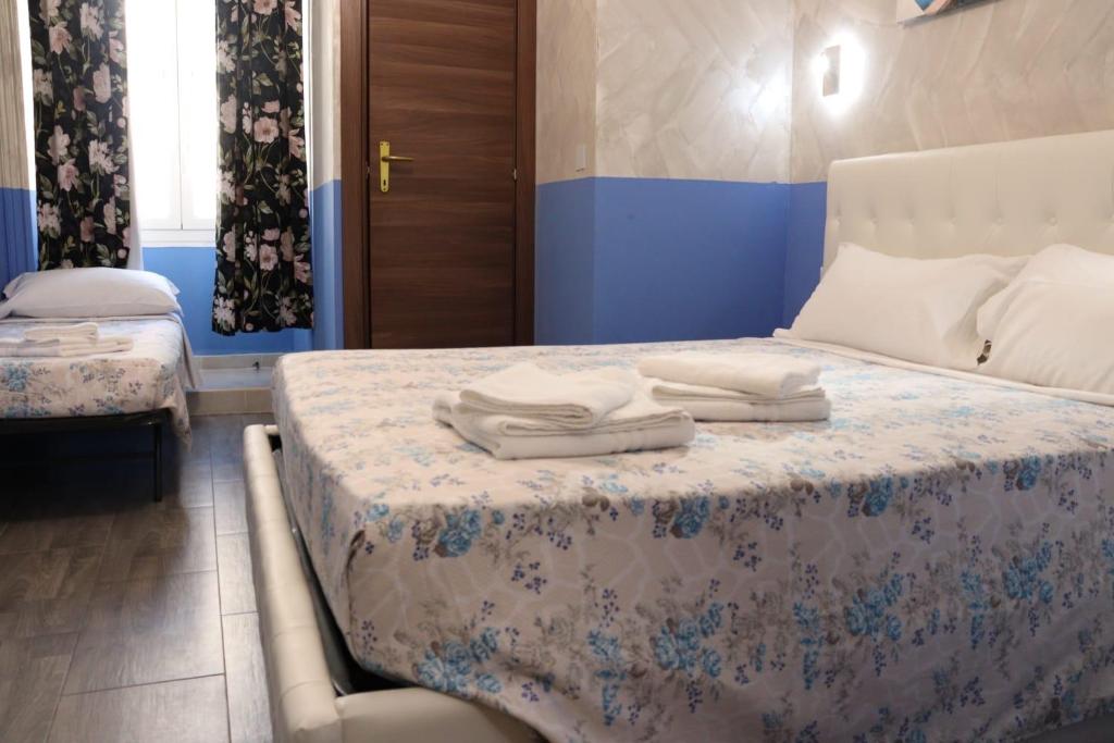 Posteľ alebo postele v izbe v ubytovaní Relaxon Guest House