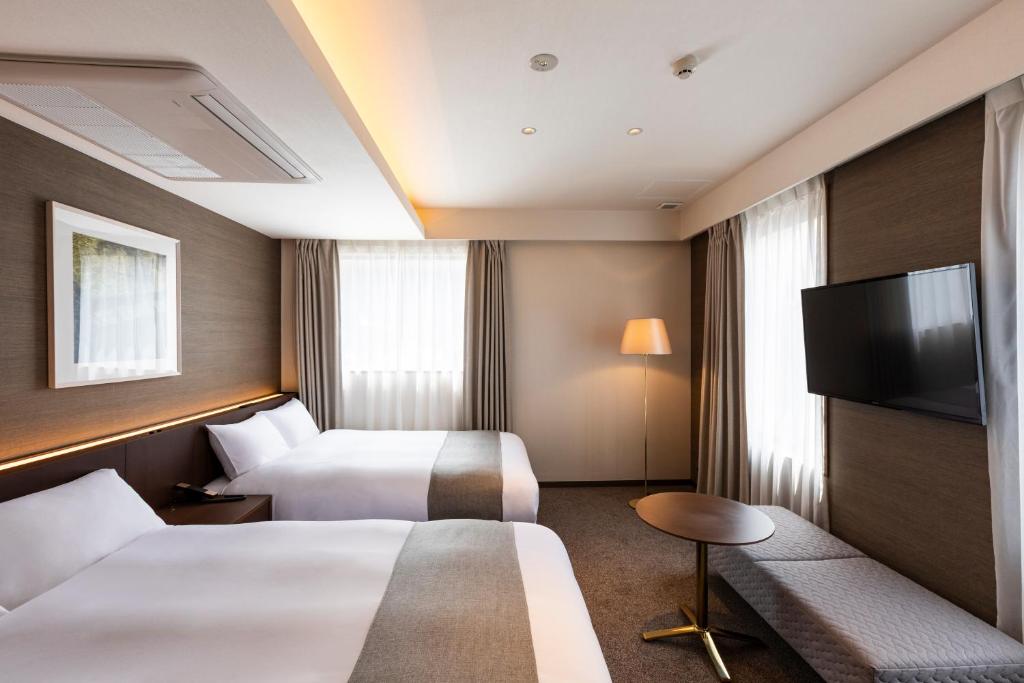 Postel nebo postele na pokoji v ubytování yoin hotel kyoto gion