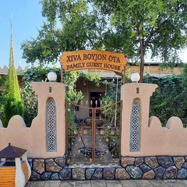 a gate to a family guest house in a yard at Guest House Khiva ,, BOYJON OTA " in Khiva