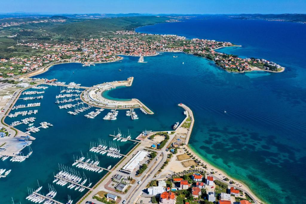 an aerial view of a harbor with boats in the water at Studio Sukosan 14681a in Sukošan