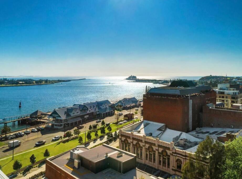 an aerial view of a city with a body of water at 3 Bedroom Apartment over looking Newcastle in Newcastle