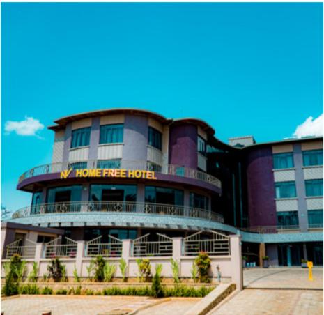 a large building with a home free hotel at Home Free Hotel in Kigali