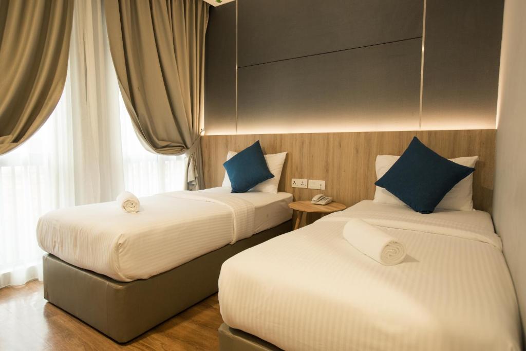 Cama o camas de una habitación en HOTEL CIQ, JALAN TRUS