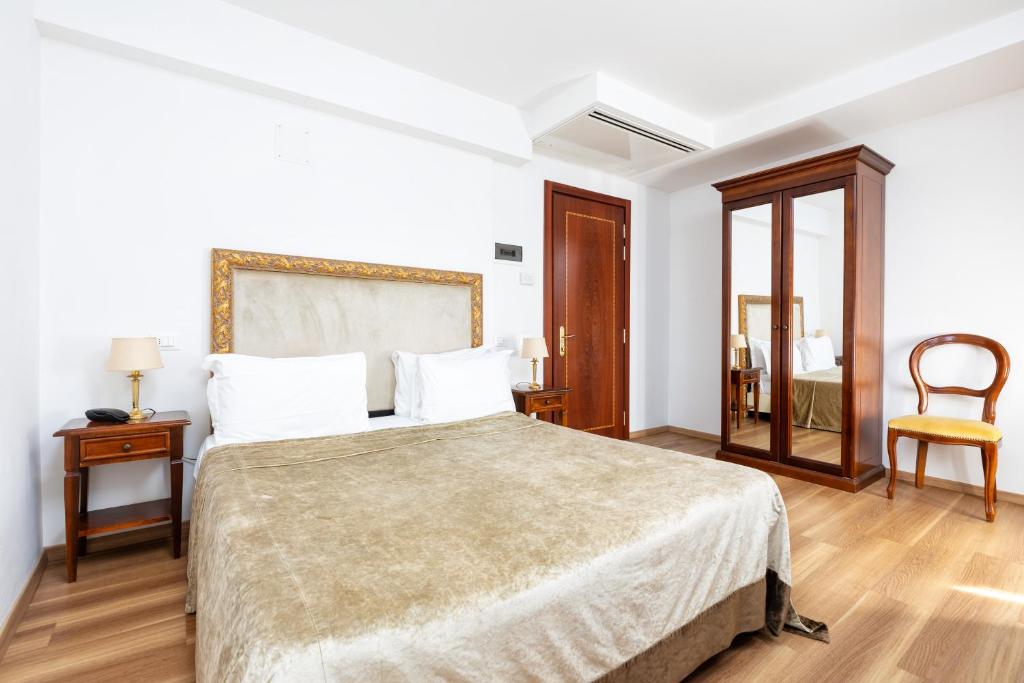 Postel nebo postele na pokoji v ubytování Hotel Giardinetto Venezia