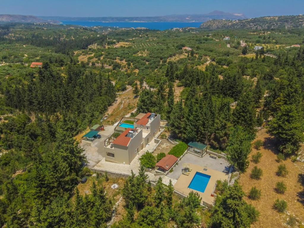 an aerial view of a house with a pool at Sea View Three Bedroom Villa Giorgios in Gavalochori