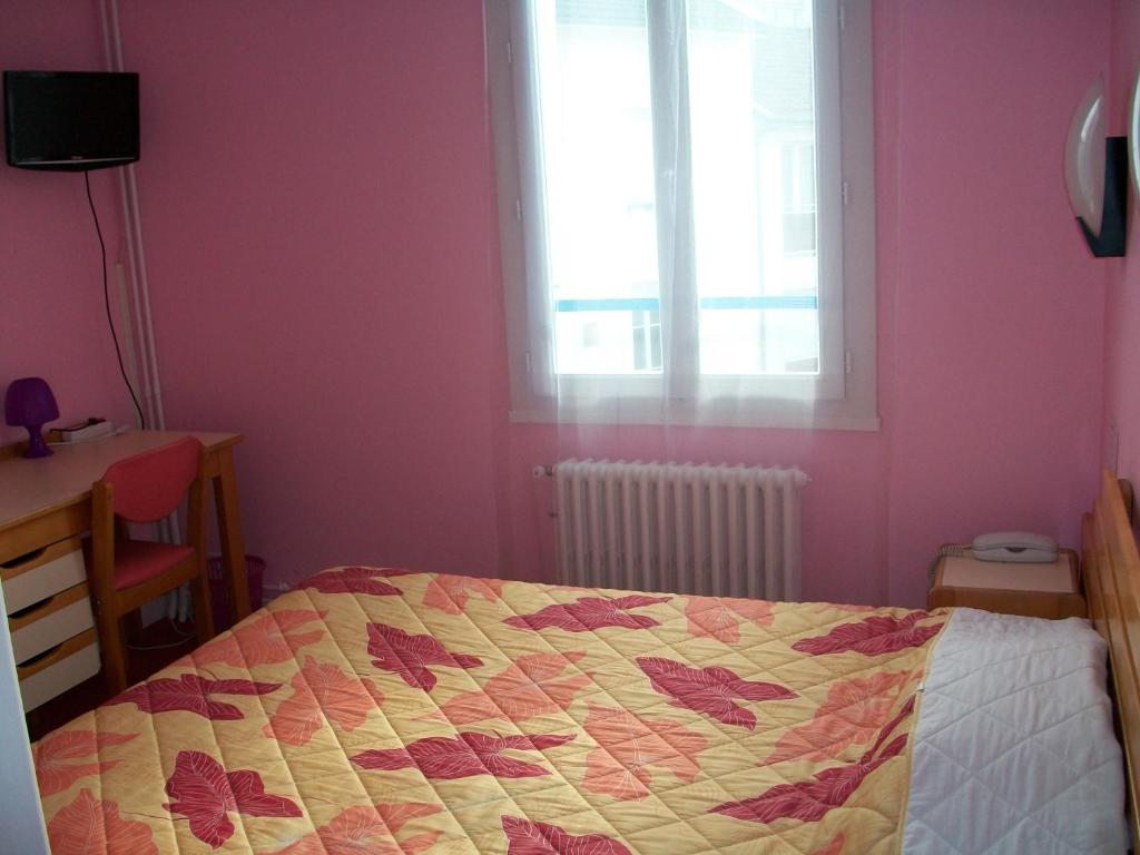 Postel nebo postele na pokoji v ubytování Hotel L'Aiglon