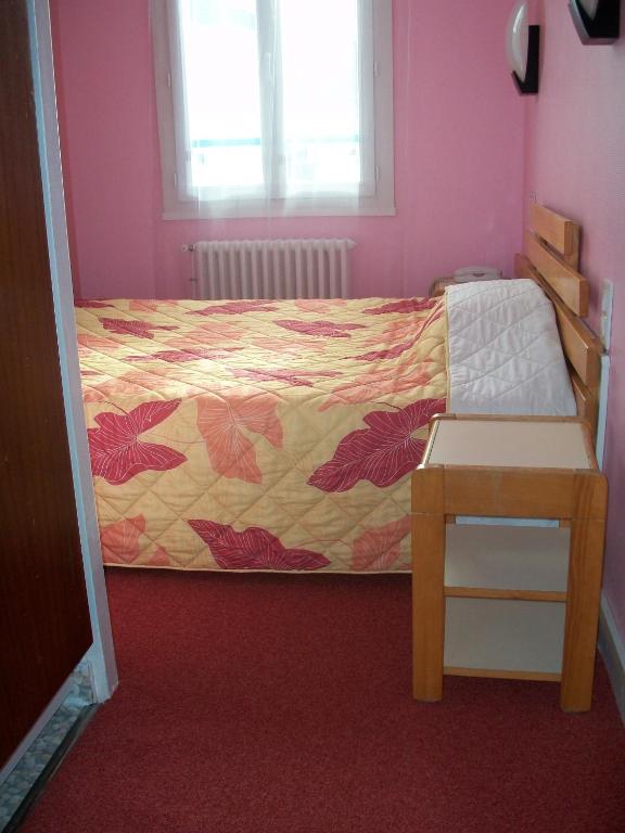 Postel nebo postele na pokoji v ubytování Hotel L'Aiglon