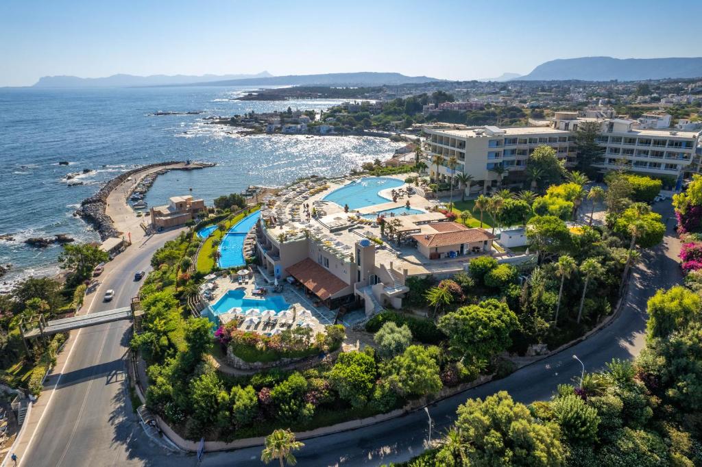 an aerial view of the resort and the ocean at Leptos Panorama Hotel in Kalamaki