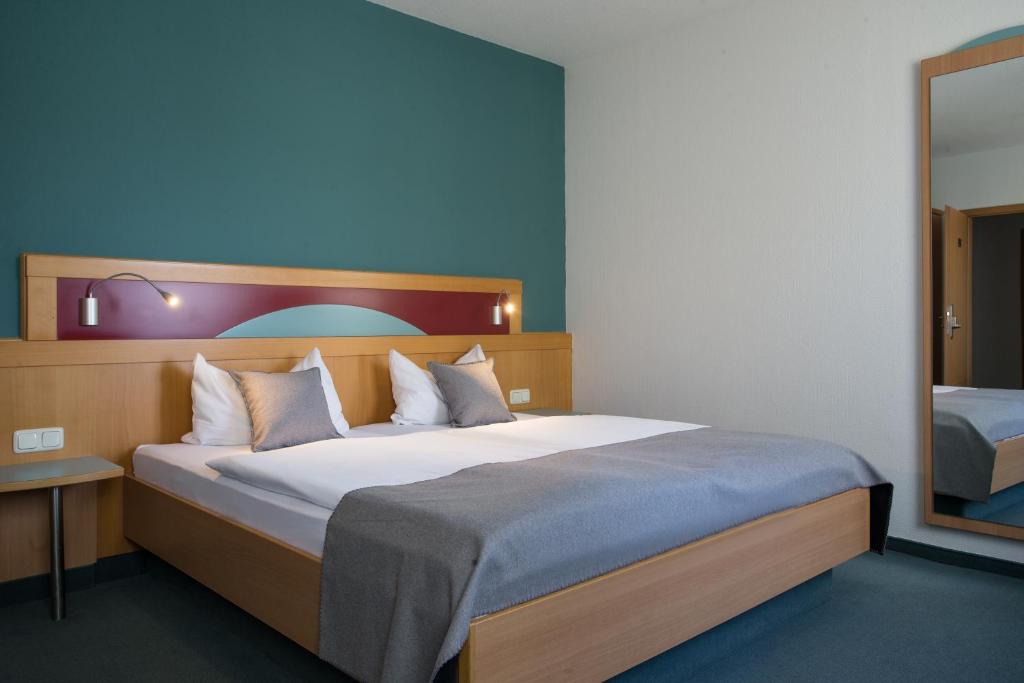 Postel nebo postele na pokoji v ubytování Hotel Gewürzmühle